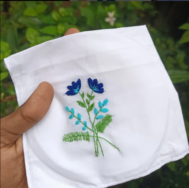 Botanical Beauty - Blue wildflowers with fern leaves arrangement